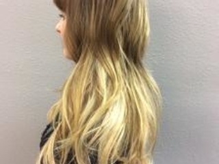 Side view of long light ombre hair extensions.  Hair extensions by Noel Strang.